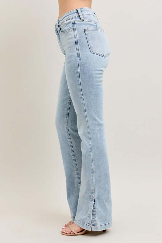 Judy Blue tummy control vintage wash side slit slim boot jeans in light blue, showcasing a stylish side view.