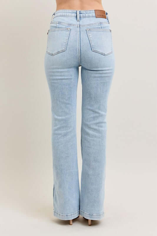 Back view of Judy Blue tummy control vintage wash side slit slim boot jeans in light blue.