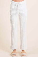 Cozy BiBi cable-knit high waist sweater pants in white, perfect for casual outings or lounging at home.