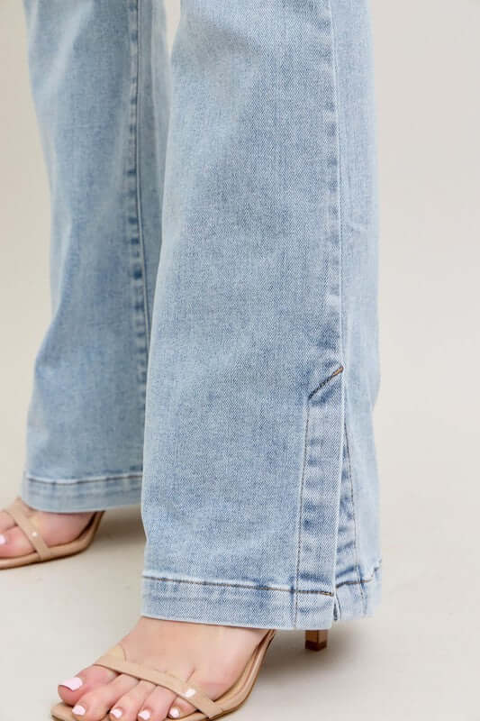 Full view of Judy Blue vintage wash slim boot jeans with side slit and stylish heels.
