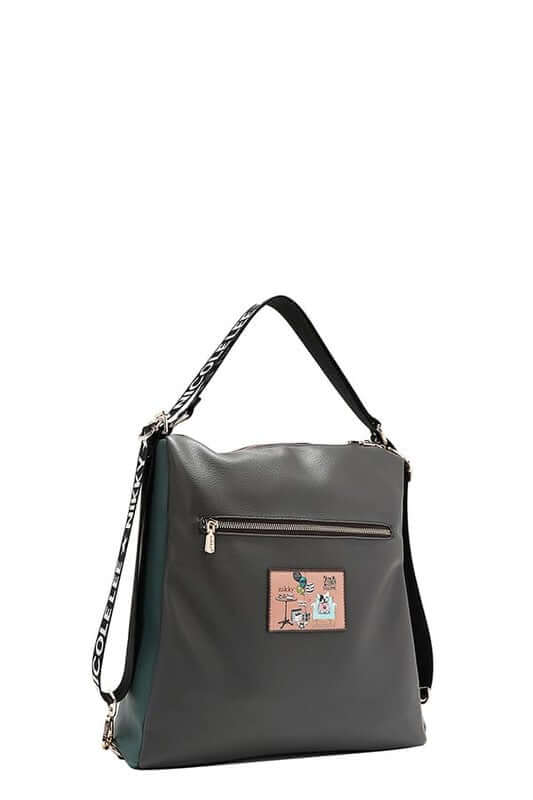 Stylish eco-leather shoulder bag with adjustable strap and playful patch design for modern fashion lovers.