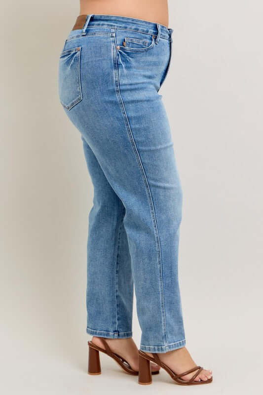Side view of Judy Blue Plus Size Tummy Control Vintage Wash Straight Jeans, showcasing a comfy fit and stylish vintage wash.