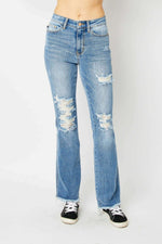 Judy Blue distressed raw hem bootcut jeans in full size with high-quality denim fabric, featuring edgy distressing and a classic bootcut silhouette.
