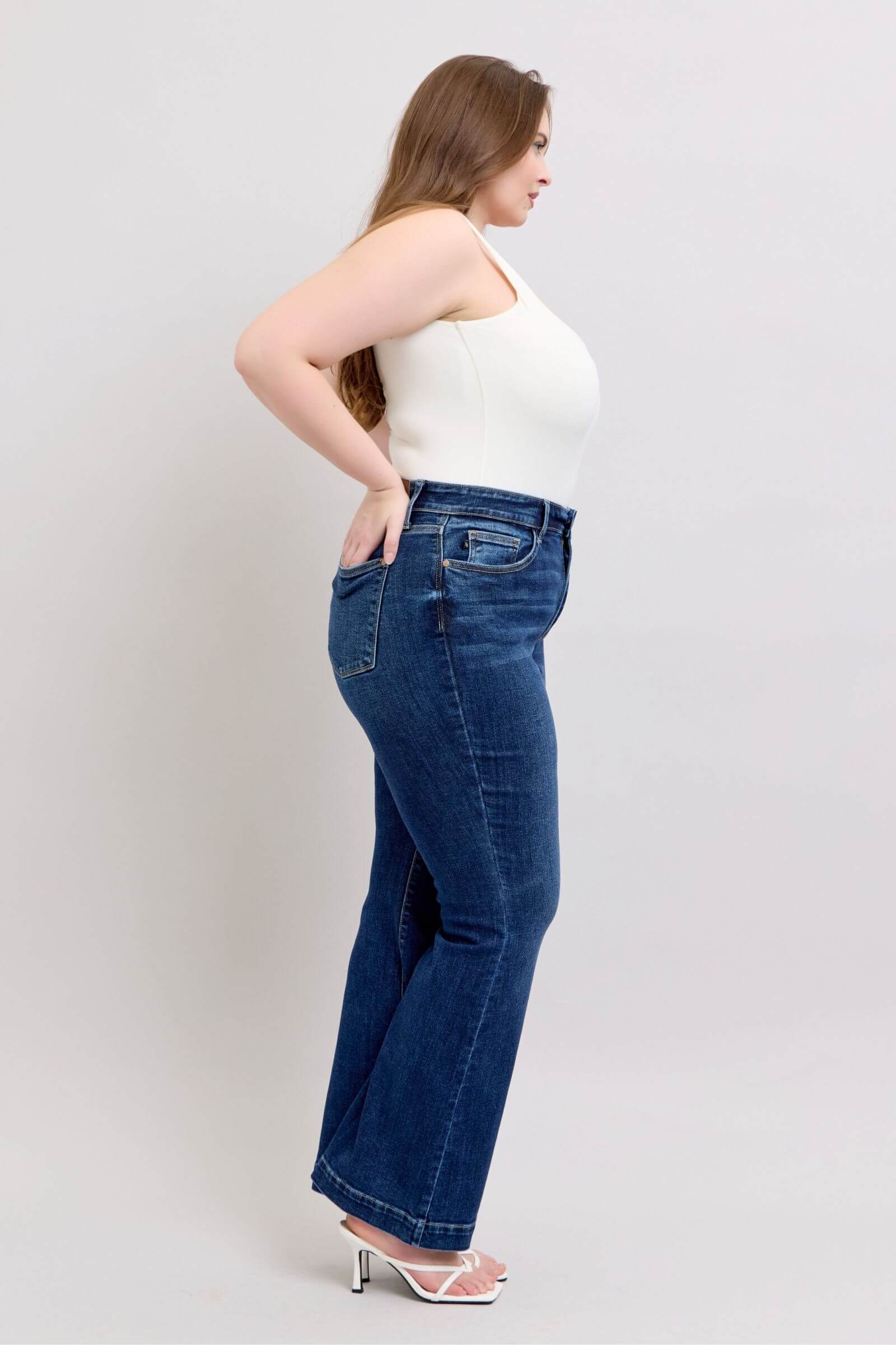 Side view of Judy Blue high rise flare jeans showcasing pockets and chic silhouette, perfect for any wardrobe.