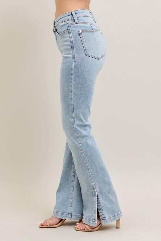Judy Blue Plus Size tummy control vintage wash side slit slim boot jeans in light blue with stylish slits.