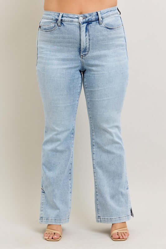 Judy Blue plus size tummy control vintage wash side slit slim boot jeans in light blue, showcasing a flattering fit.