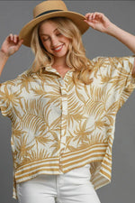 Umgee Tropical Print Button Down Shirt in vibrant gold, perfect for a stylish island-inspired look.