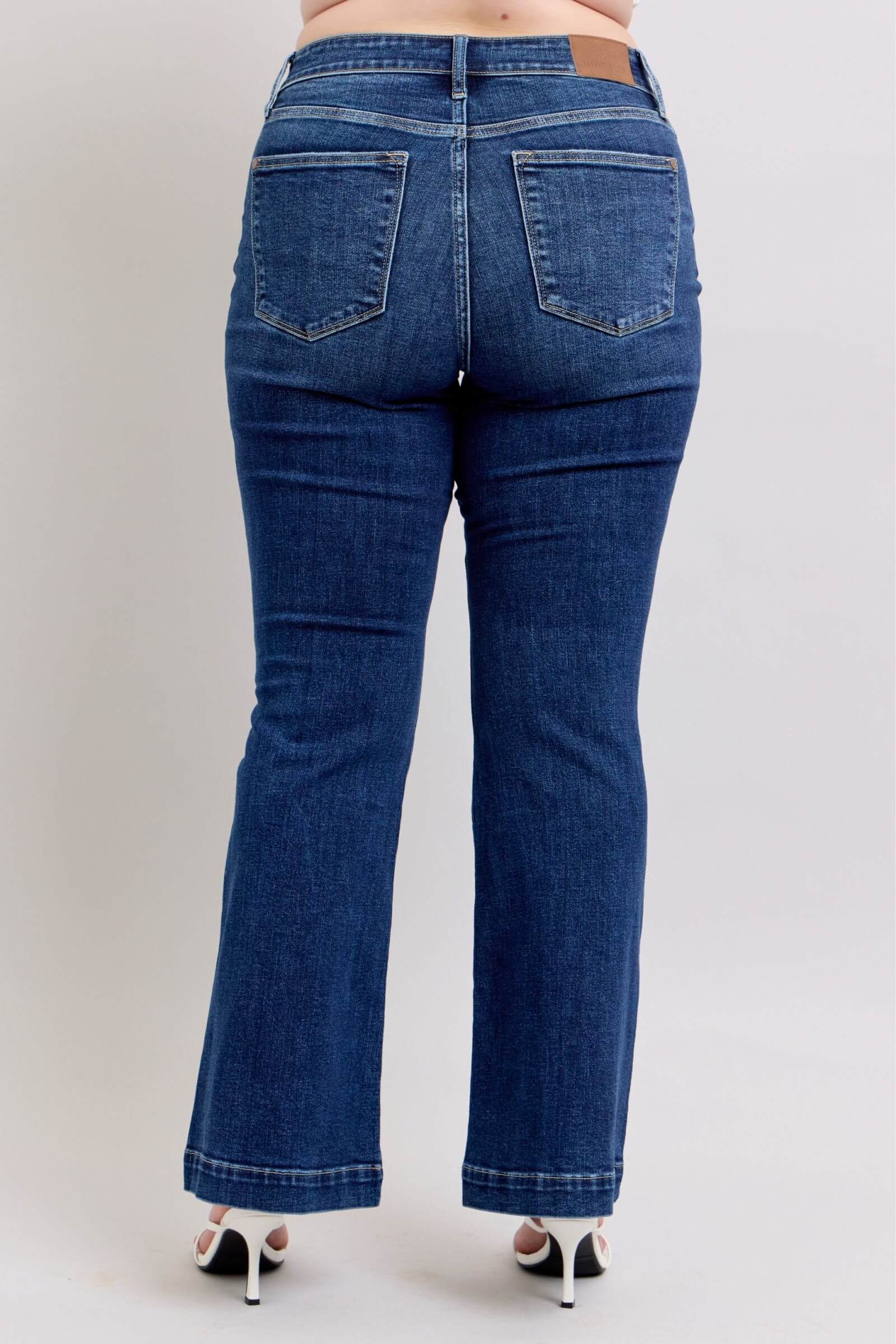Back view of Judy Blue plus size high-rise flare jeans with functional pockets and stylish design.