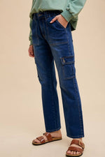 Stylish straight leg jeans with cargo pockets, perfect for a casual, utilitarian-inspired outfit.