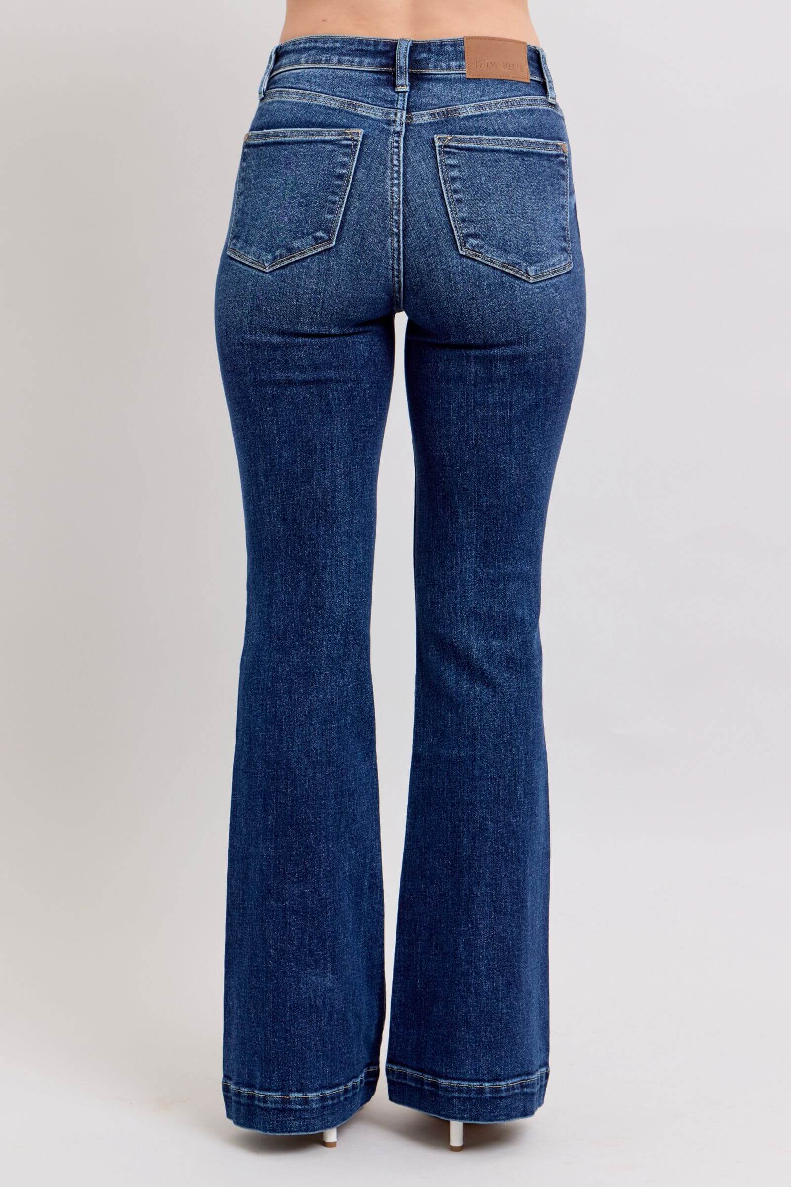 Back view of Judy Blue full size high rise flare jeans with pockets, showcasing a stylish and flattering fit.