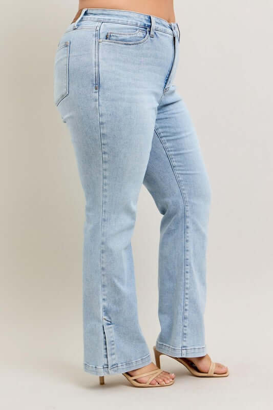 Judy Blue tummy control vintage wash side slit slim boot jeans in light blue, ideal for flattering and stylish comfort.