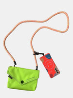 Vibrant green envelope-shaped crossbody bag with pink strap, showcasing a stylish and trendy accessory for any outfit.