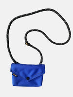 Stylish blue envelope shape crossbody bag with removable strap and black and white braided handle. Perfect for any occasion!