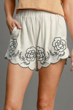 Umgee plus size linen blend shorts with floral embroidery, lightweight and perfect for summer, featuring pocket detail.