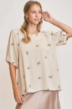 Umgee plus size linen blend top with delicate ribbon embroidery, perfect for warm weather and stylish comfort.