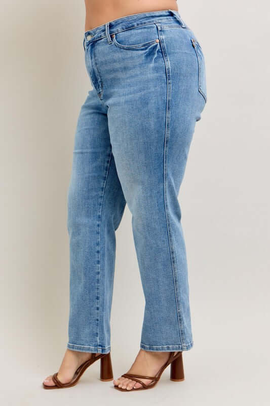 Judy Blue plus size tummy control vintage wash straight jeans styled with heels, showcasing a flattering fit.