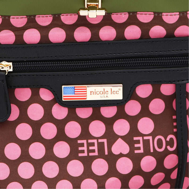 Close-up of Nicole Lee USA Flower Pattern Adjustable Strap Backpack Bag with pink polka dots and brand label.