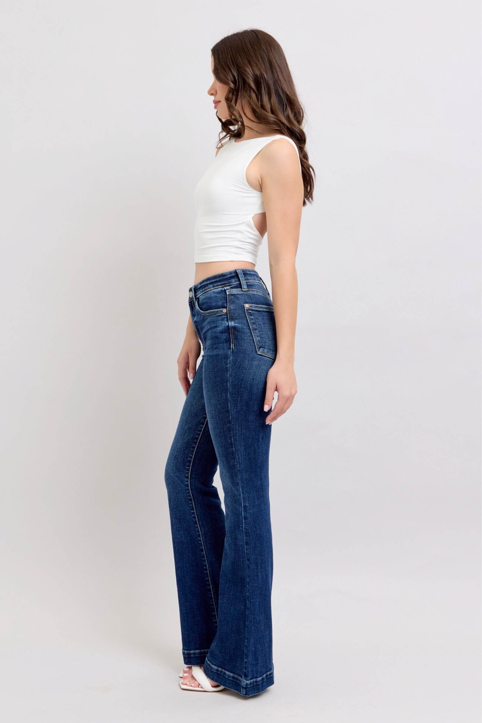 Side view of Judy Blue full-size high rise flare jeans with pockets, showcasing a chic retro silhouette.