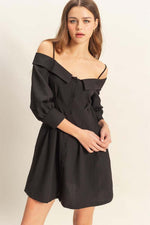 Chic black button-down spaghetti strap mini dress with pockets and off-shoulder design, perfect for warm weather.