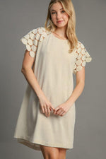 Umgee round neck mini dress in beige with textured lace raglan sleeves, perfect for elegant occasions.