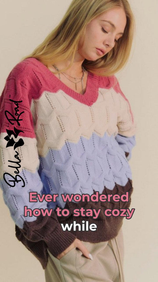 Model in a colorful, wavy texture V-neck sweater showcasing cozy style options.