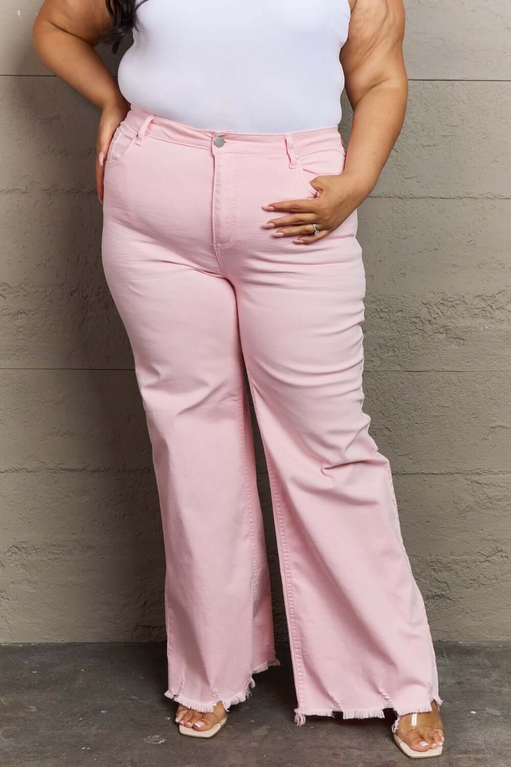 Risen Jeans Raelene High Waist Wide Leg Jeans in Light Pink for a chic and modern look, flattering various body types with retro flair.