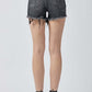 Woman wearing Risen Jeans Raw Hem Denim Shorts with Pockets, showcasing the back view with casual and trendy style.