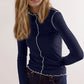 Woman wearing Basic Bae Contrast Trim Mock Neck Long Sleeve T-Shirt in navy, showcasing stylish ruffle trim.