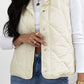 Stylish ivory snap down vest coat with texture and pockets, perfect for fall and winter fashion from Bella Road.