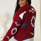 Woman wearing HEYSON full size Aztec soft fuzzy sweater in red with intricate pattern, showcasing cozy and stylish design.