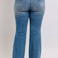 Back view of Judy Blue Mid Rise Tummy Control Vintage Wash Jeans showcasing stylish fit and retro wash.