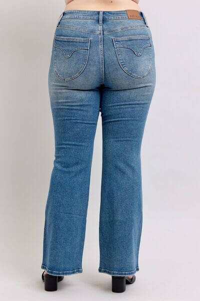 Back view of Judy Blue Mid Rise Tummy Control Vintage Wash Jeans showcasing stylish fit and retro wash.