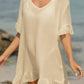 Beige tied ruffled half sleeve cover-up, perfect for beachwear, made of 65% cotton and 35% polyester, machine wash cold, tumble dry low.