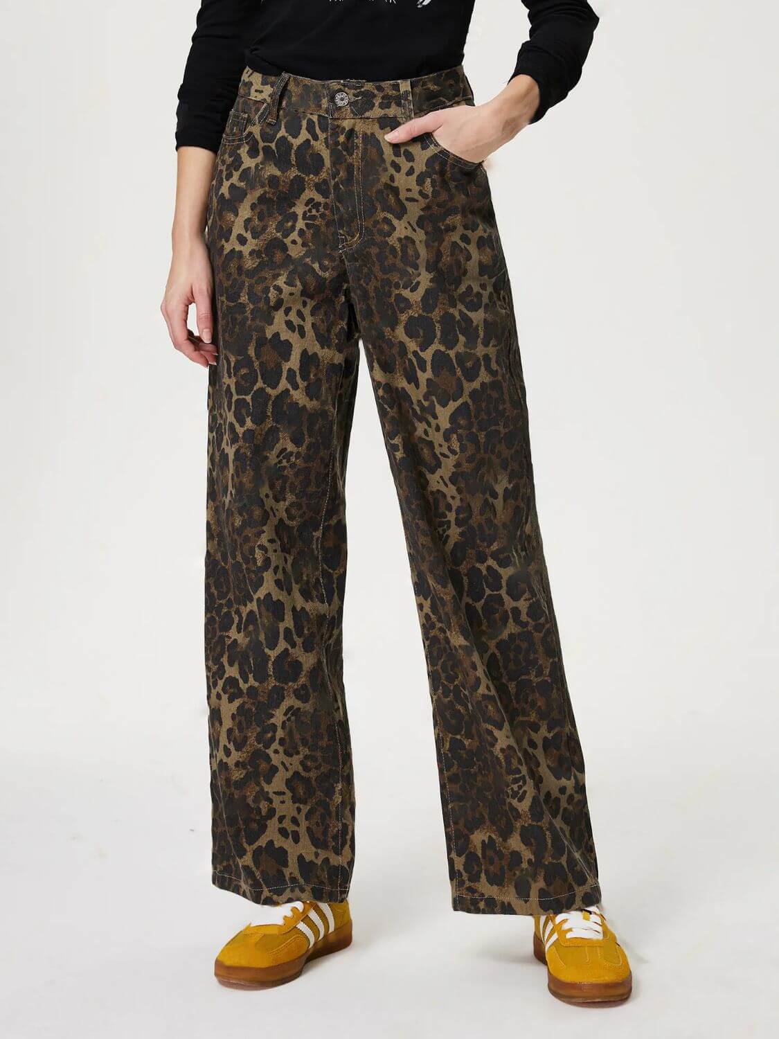 Model wearing Bella Road Denim Leopard Straight Jeans with pockets, showcasing a bold leopard print and stylish straight leg cut.