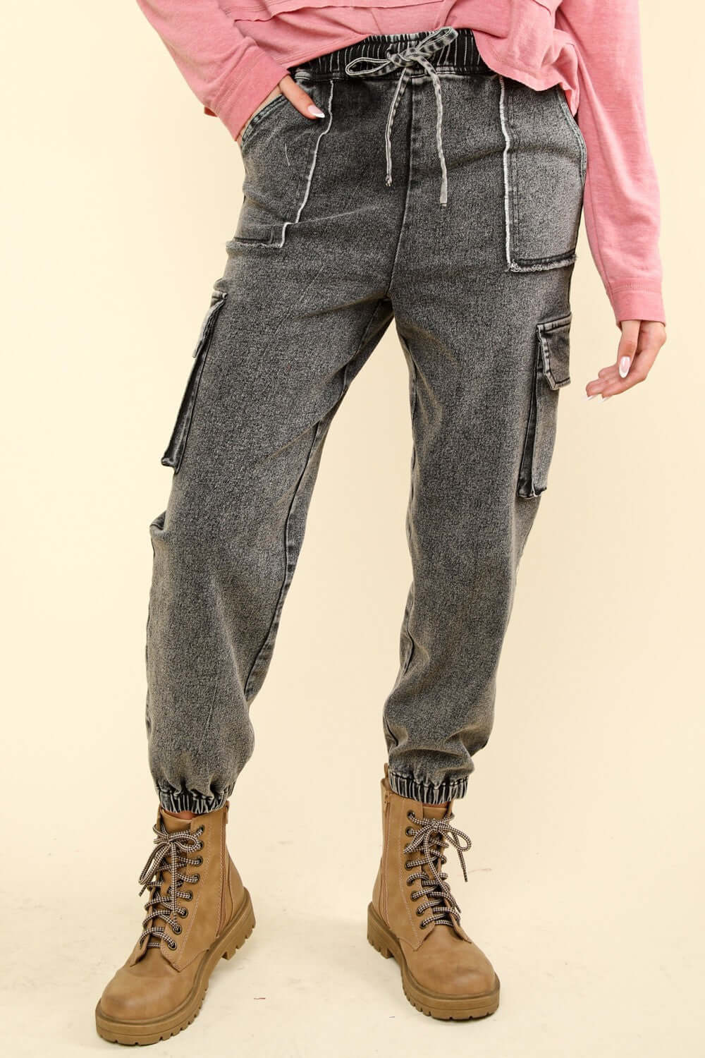 Washed drawstring jogger cargo jeans with pockets and raw detail, perfect blend of comfort and style for casual outings.