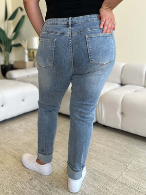 High Waist Cuff Hem Skinny Jeans by Judy Blue, back view showcasing cuffed hem and high waist fit, model wearing white sneakers.