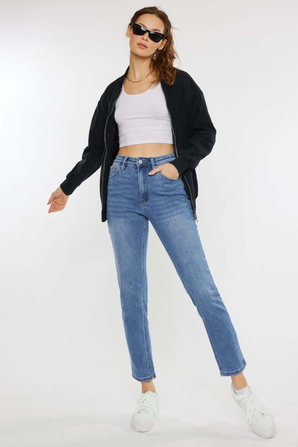 Trendy model wearing Cat's Whiskers High Waist Jeans with a casual outfit, showcasing vintage charm and figure-flattering silhouette.