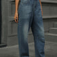 Woman wearing Half Elastic Waist Straight Leg Jeans showcasing a comfortable fit and style against a grey background.