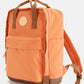 Orange waterproof canvas backpack with side pockets and durable straps. Perfect for stylish organizing and carrying essentials.