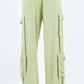 Light green linen wide leg cargo pants with utility pockets for a stylish and comfortable look.