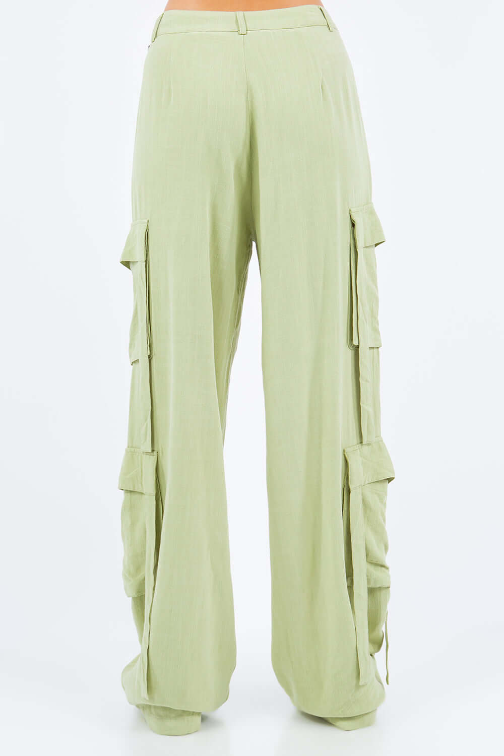 Light green linen wide leg cargo pants with utility pockets for a stylish and comfortable look.