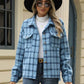 Woman wearing Bella Road Plaid Collared Neck Long Sleeve Jacket with buttoned front and pockets, styled for cool weather with a hat and sunglasses.