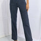 Woman wearing Cassidy high waisted tummy control striped straight Judy Blue jeans for a flattering fit