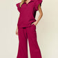 Woman wearing a Texture Ruffle Short Sleeve Top and Drawstring Wide Leg Pants Set in dark pink; features drawstring, pockets, and short sleeves.