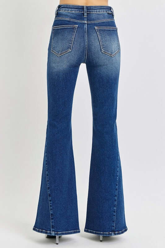 Back view of RISEN Distressed Button-Fly Flare Jeans showcasing a stylish flared leg and trendy distressed design.