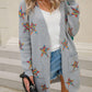 Woman wearing Angel Wings Star Cardigan with playful star design, staying cozy and stylish outdoors in trendy streetwear.