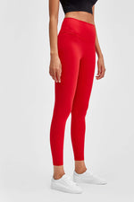 Red Millennia wide seamless band waist sports leggings showcased on a model for stylish workout comfort.