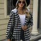 Woman wearing Bella Road Drawstring Plaid Long Sleeve Hooded Jacket with sunglasses and black hat in an outdoor setting