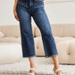 Woman wearing Tummy Control High Waist Raw Hem Distressed Jeans with tummy control technology and trendy raw hem. RFM Jeans.