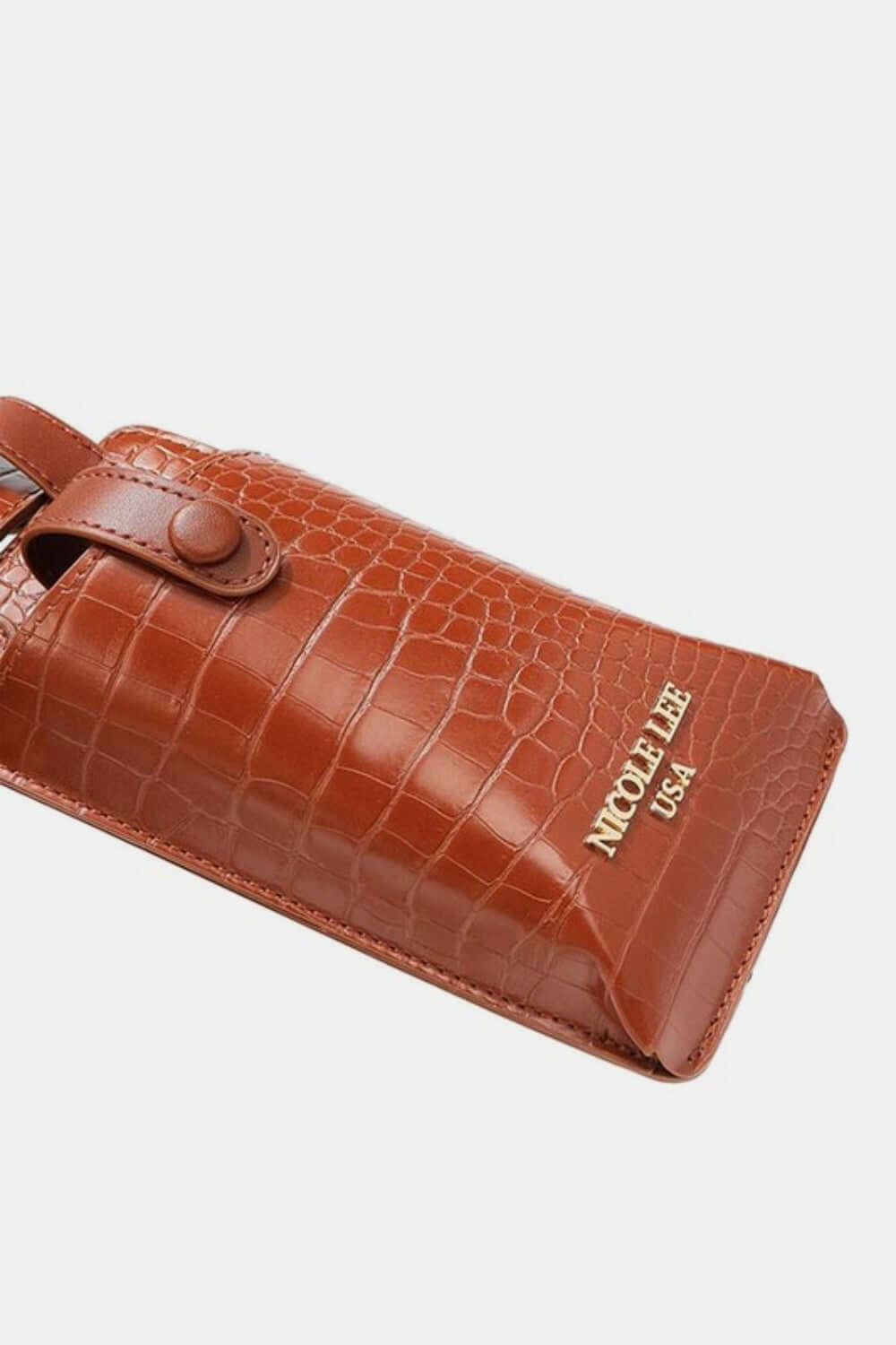 Nicole Lee USA textured brown vegan leather phone case with faux croc-texture from Albina 2 piece belt bag set